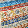 Tesatura fina din bumbac cu broderie  spartă - benzi etno cu motive florale , Multicolor