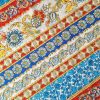 Tesatura fina din bumbac cu broderie  spartă - benzi etno cu motive florale , Multicolor