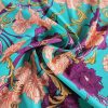 Tesatura din matase naturala elastica - design stilizat floral , turcoaz – portocaliu – bordo - auriu