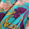 Tesatura din matase naturala elastica - design stilizat floral , turcoaz – portocaliu – bordo - auriu
