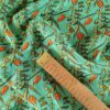 Tesatura crepe de chine din matase naturala - Imprimeu floral / ghirlande de flori portocalii pe fond verde turcoaz - imagine 2