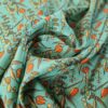 Tesatura crepe de chine din matase naturala - Imprimeu floral / ghirlande de flori portocalii pe fond verde turcoaz - imagine 7