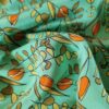 Tesatura crepe de chine din matase naturala - Imprimeu floral / ghirlande de flori portocalii pe fond verde turcoaz - imagine 4