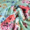 Tesatura tip shantung din matase naturala - motive florale și fluturi multicolor pe fond verde deschis - imagine 10