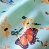 Tesatura tip shantung din matase naturala - motive florale și fluturi multicolor pe fond verde deschis - imagine 7