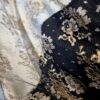 Tesatura premium - Dantela Chantilly cu borduri bilaterale cu flori aurii pe fond negru - imagine 2