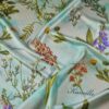 Tesatura crepe de Chine din matase naturala cu imprimeu floral multicolor pe fond Verde / Ivoire