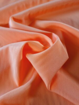 Tesatura fluida - crepe din matase naturala cu design uni, Orange deschis