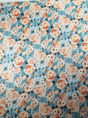 Țesătură din bumbac, moale, cu granulație tip piqué, cu imprimeu floral portocaliu/bleu